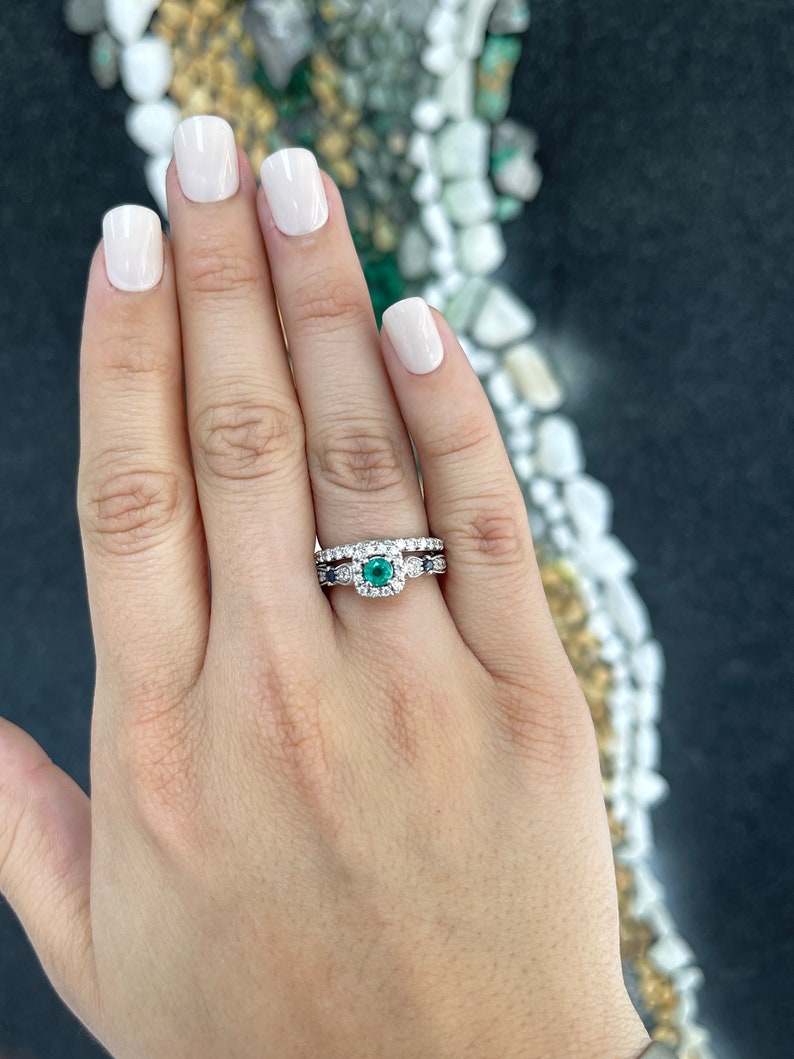 Intricate 14K gold engagement ring with natural emerald, sapphire, and diamond accents from Colombian Emerald collection.