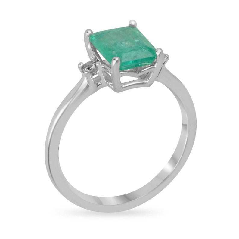 Sterling silver 3-stone ring with 1.70tcw green emerald cut and round diamond accents, Colombian Emerald brand.