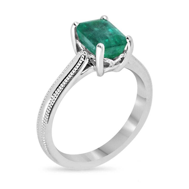 14K Colombian Emerald engagement ring with a 1.95 carat four-prong solitaire emerald gemstone on a sleek band