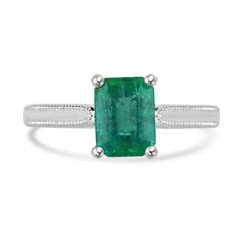 14K Colombian Emerald solitaire engagement ring with a 1.95 carat four-prong emerald gemstone and elegant band.
