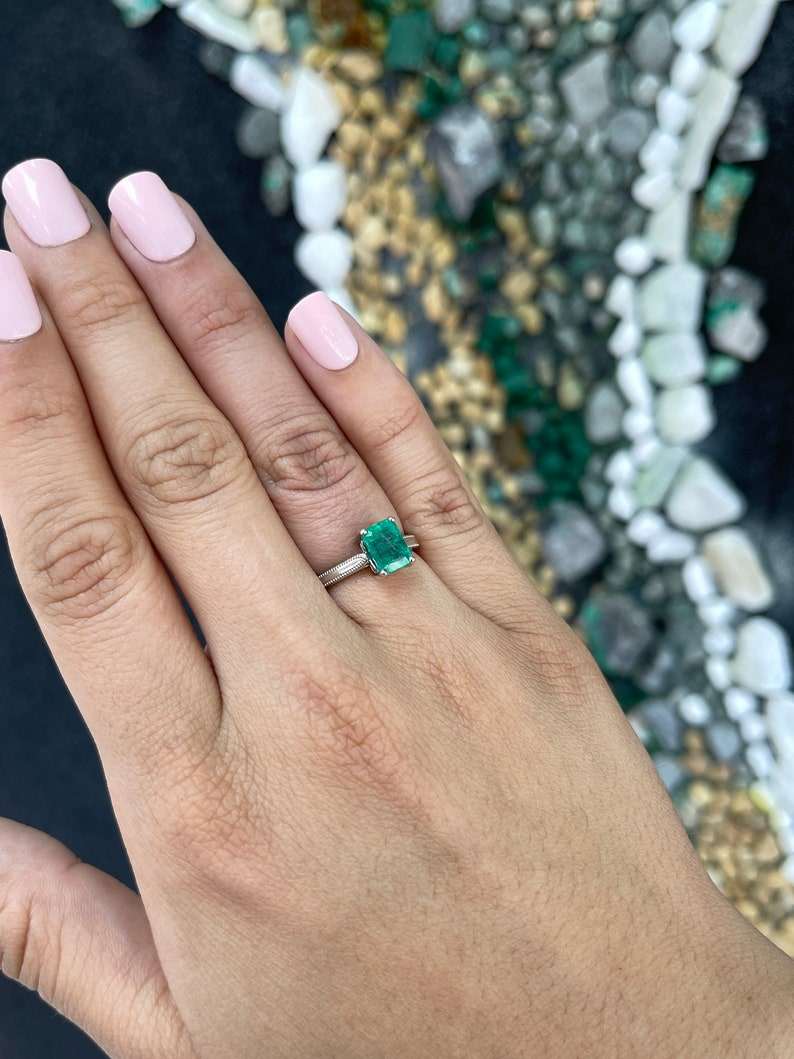 14K Colombian Emerald engagement ring featuring a 1.95 carat four-prong solitaire emerald center stone.