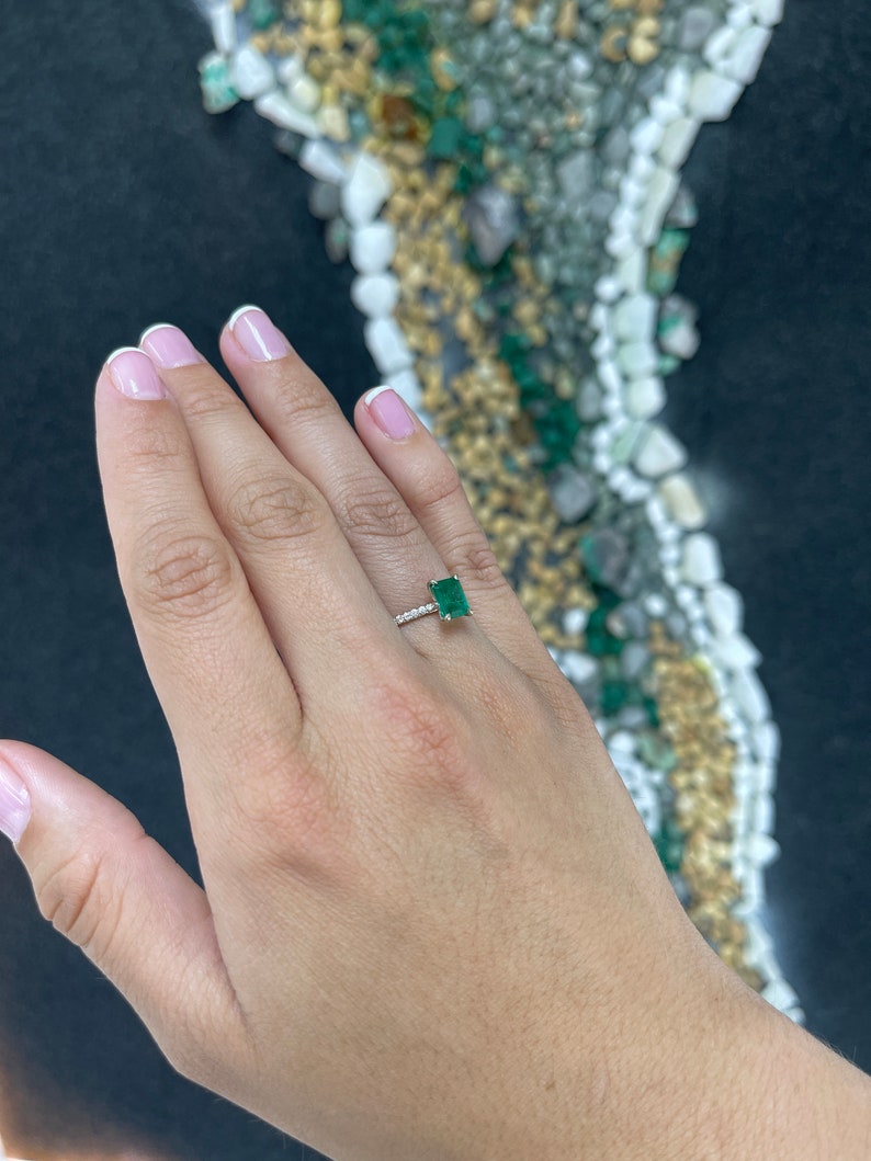 14K white gold engagement ring with a 1.95tcw rich dark green emerald and diamond accents, designed for right hand wear.