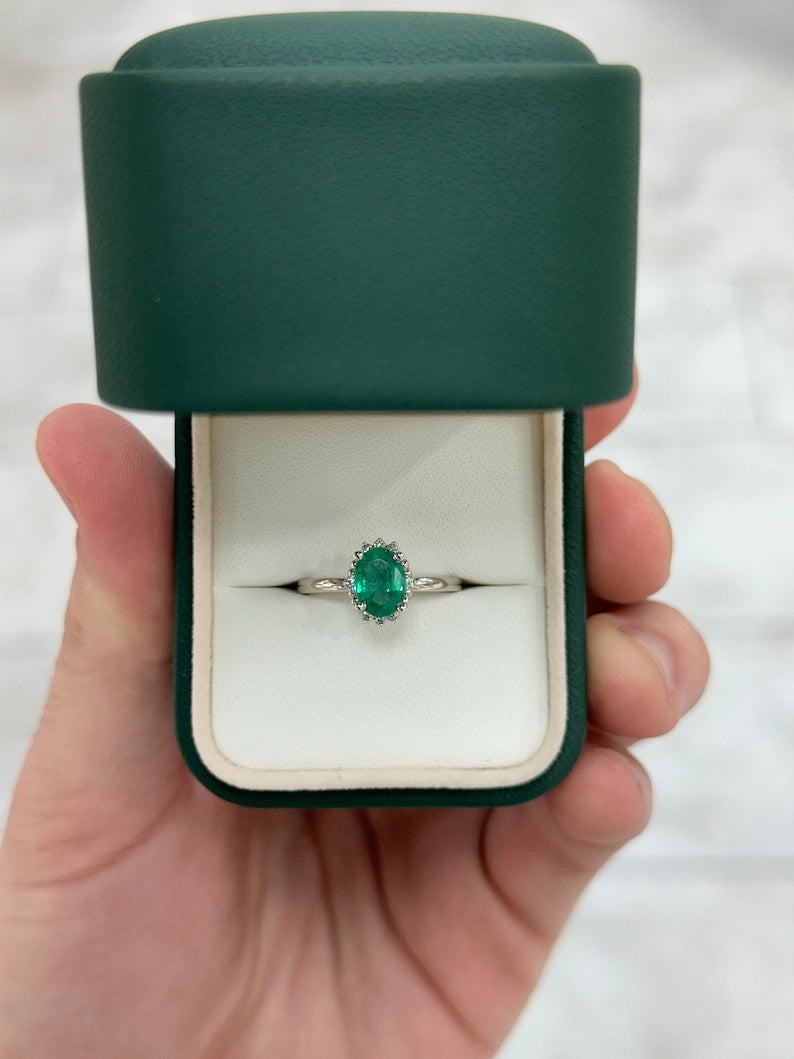 14K gold emerald ring with oval cut green emerald and small dark green diamond accents, Colombian Emerald brand.