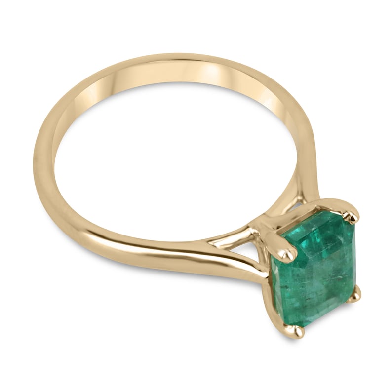 14K gold emerald cut green emerald solitaire ring with 2.25ct stone and four-prong setting, perfect for right hand wear.