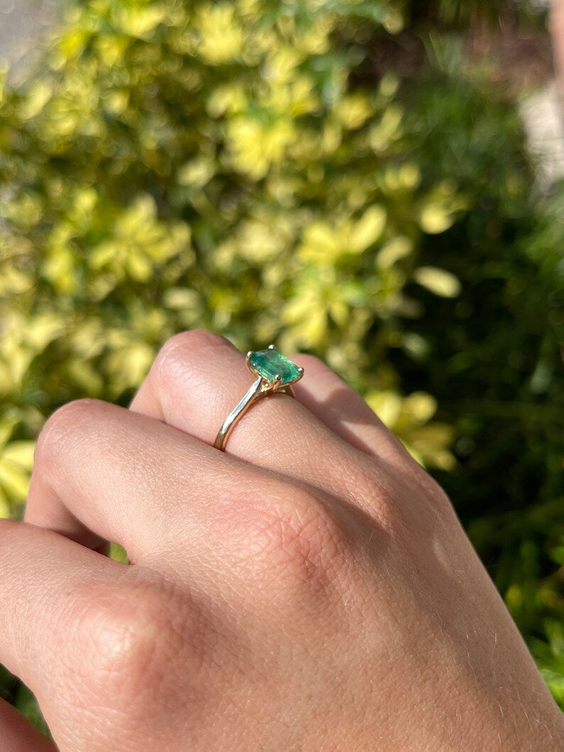 14K gold emerald cut green emerald solitaire ring with 4 prongs on a right hand, Colombian Emerald branded jewelry image