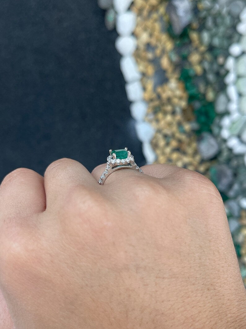East to West 2.50tcw emerald and diamond halo engagement ring in 14K gold by Colombian Emerald, featuring a sleek shank design.