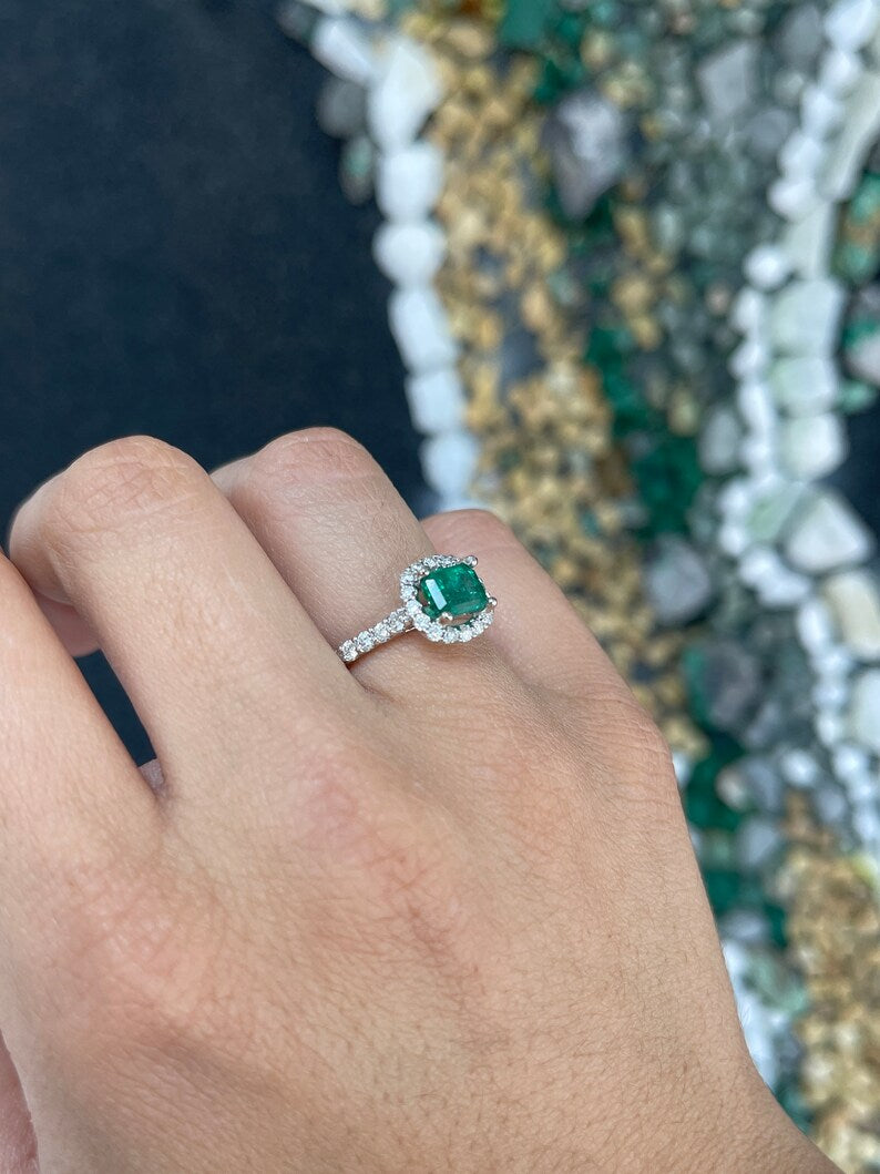 East to West emerald and diamond halo engagement ring in 14K gold with Colombian Emerald branding, featuring a 2.50tcw center stone.