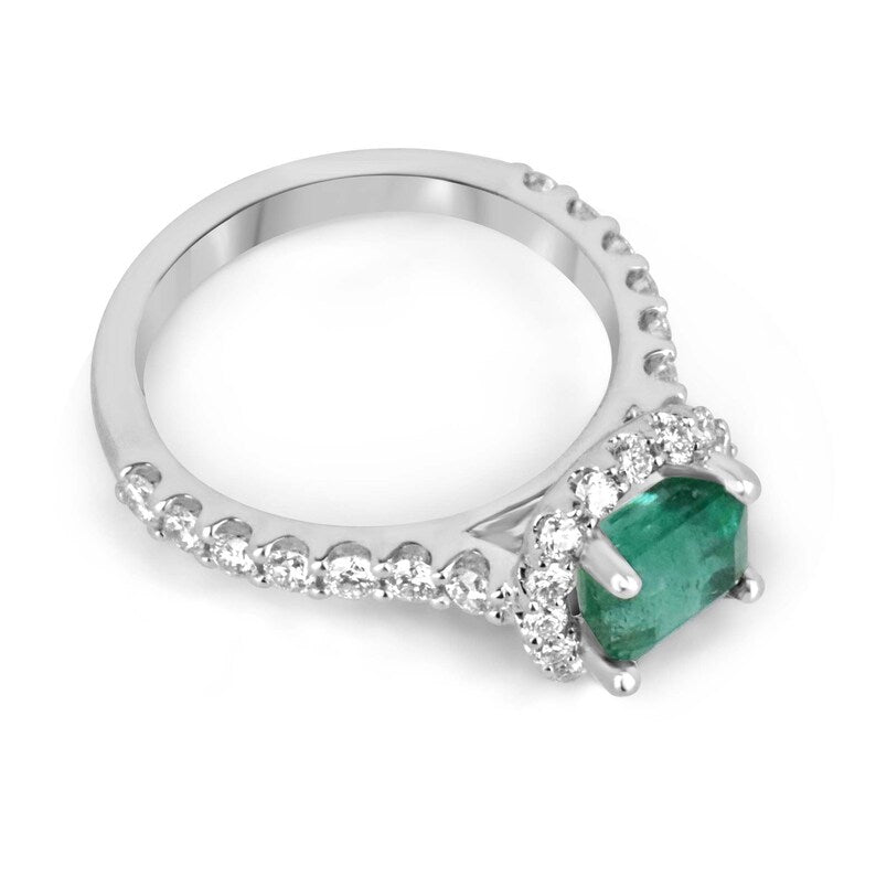 East to West emerald and diamond halo engagement ring in 14K gold, featuring a 2.50tcw Colombian emerald centerpiece.