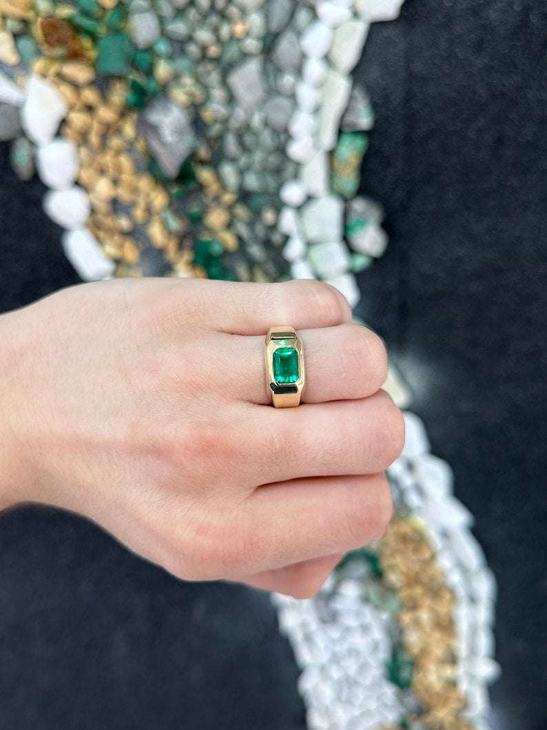 Colombian Emerald AAA+ rich green 2.70ct east-west emerald cut solitaire gypsy ring with a sleek band.