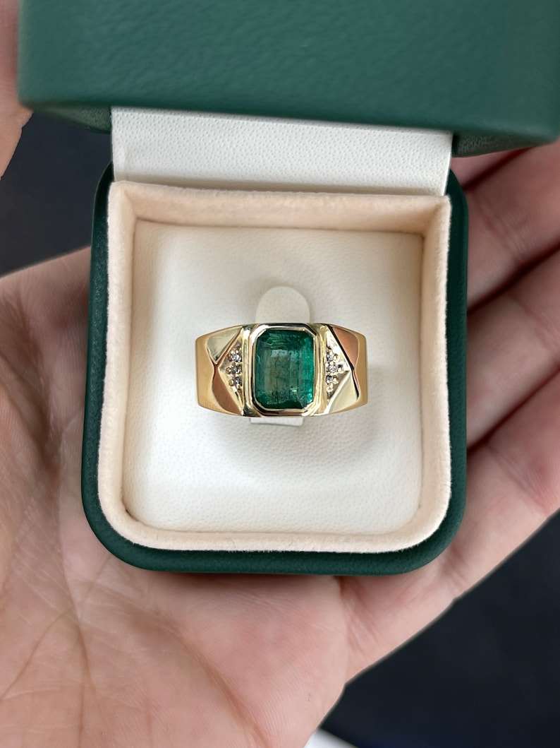 14K gold men's ring with a dark green natural emerald cut emerald and diamond accents, featuring Colombian Emerald branding.