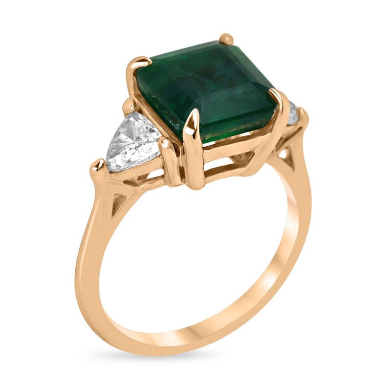 14K gold Colombian Emerald engagement ring with trillion and asscher cut emeralds and diamonds, three-stone design.