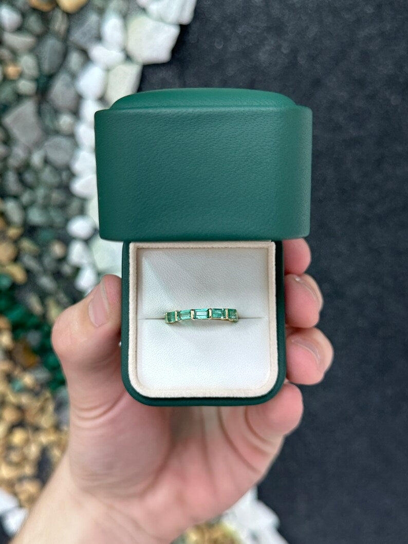 14K gold wedding band with large emerald baguette diamonds, Colombian Emerald brand, size 7, showing detailed ring design.