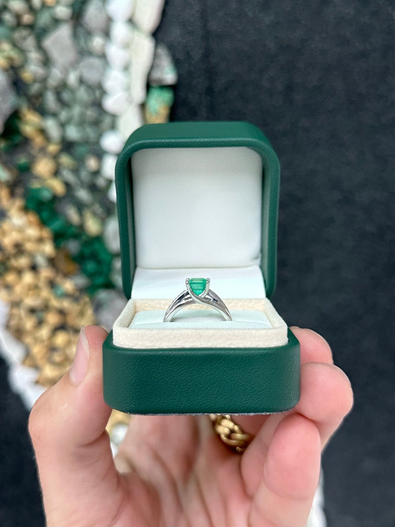 14K white gold emerald solitaire ring with diamond accents, featuring a vibrant earth-mined Colombian emerald.