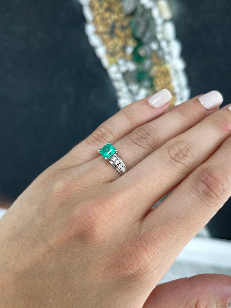 14K white gold ring featuring a 1.74ctw emerald centerpiece with diamond accents, Colombian emerald solitaire jewelry.