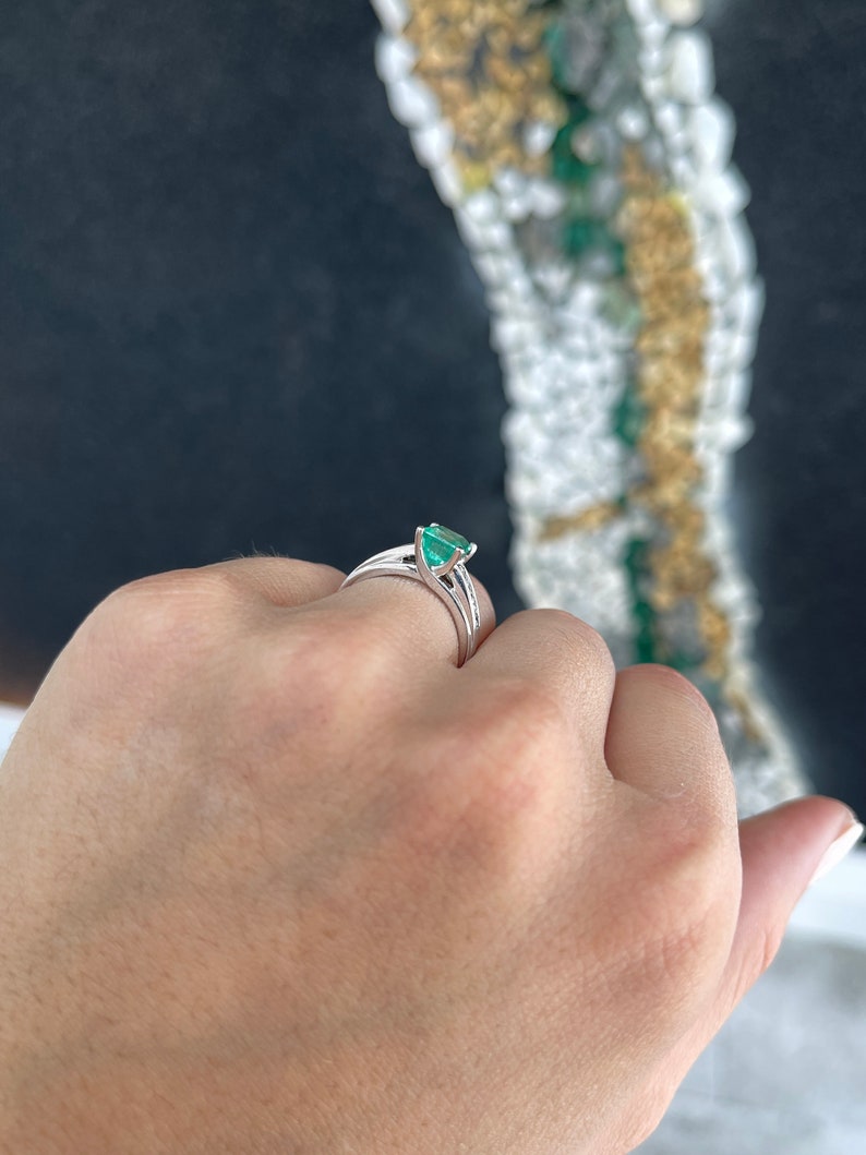 14K white gold ring with a 1.74 carat earth-mined emerald center and diamond accents, Colombian Emerald brand.