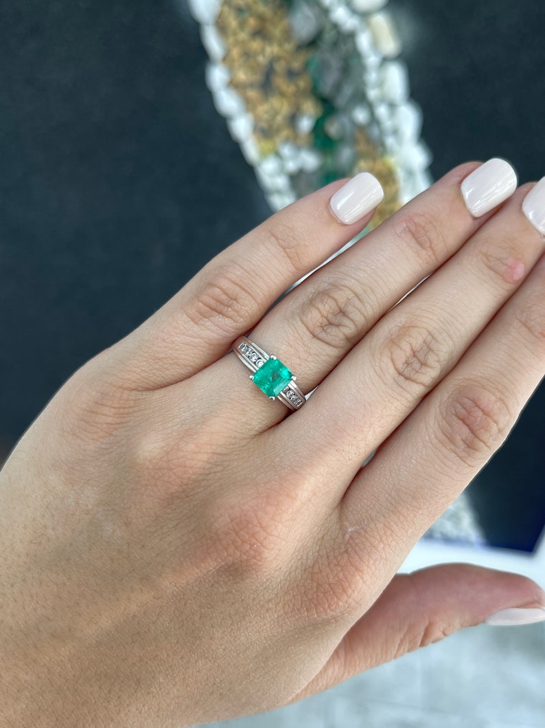 14K white gold emerald solitaire ring with diamond accents, featuring an earth-mined Colombian emerald centerpiece.