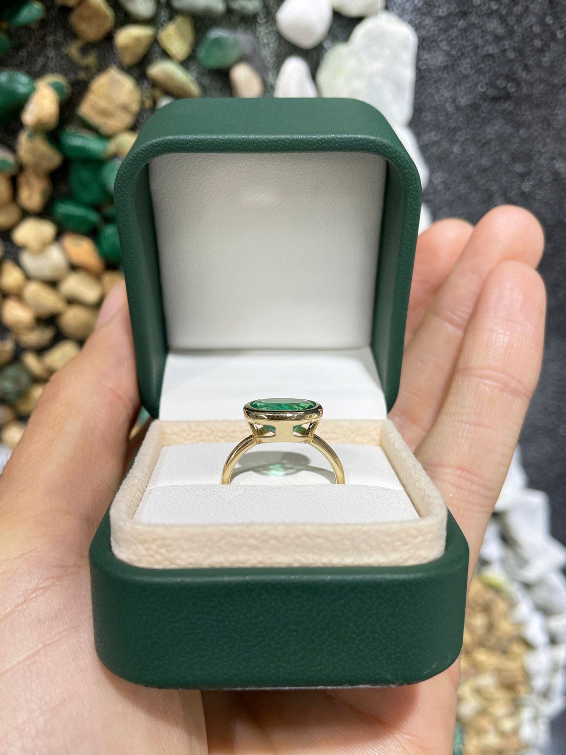 14K gold oval emerald solitaire ring with east-west setting, featuring a rich green Colombian emerald by JR Colombian Emeralds.
