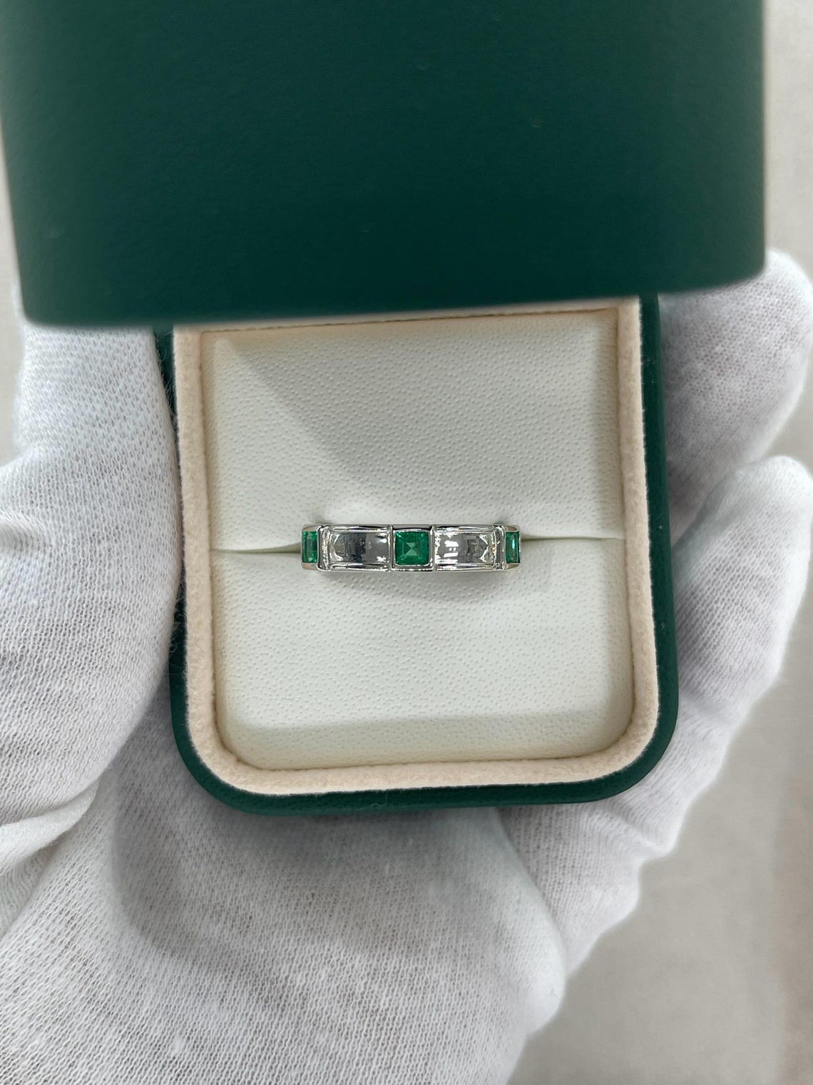 Men's 14K gold emerald three-stone band ring with rich green princess-cut gemstones by JR Colombian Emeralds.