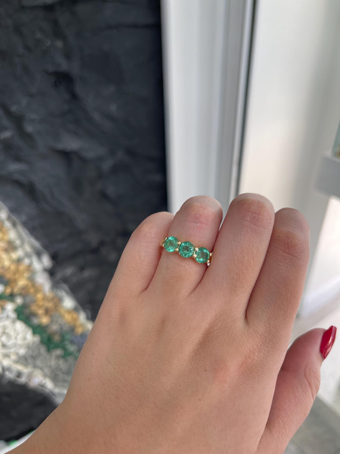 Ladies 2.20 Carat round emerald three-stone band ring in 14K gold with prong setting, featuring rich green Colombian emeralds.