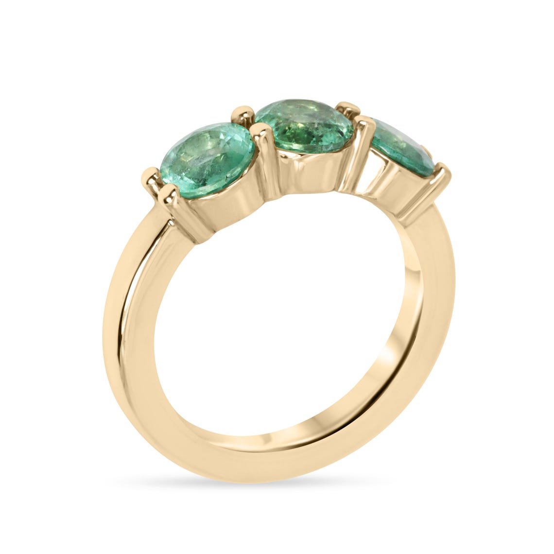 Ladies 2.20 carat round emerald three-stone band ring in 14K gold with prong settings, featuring rich green Colombian emeralds.