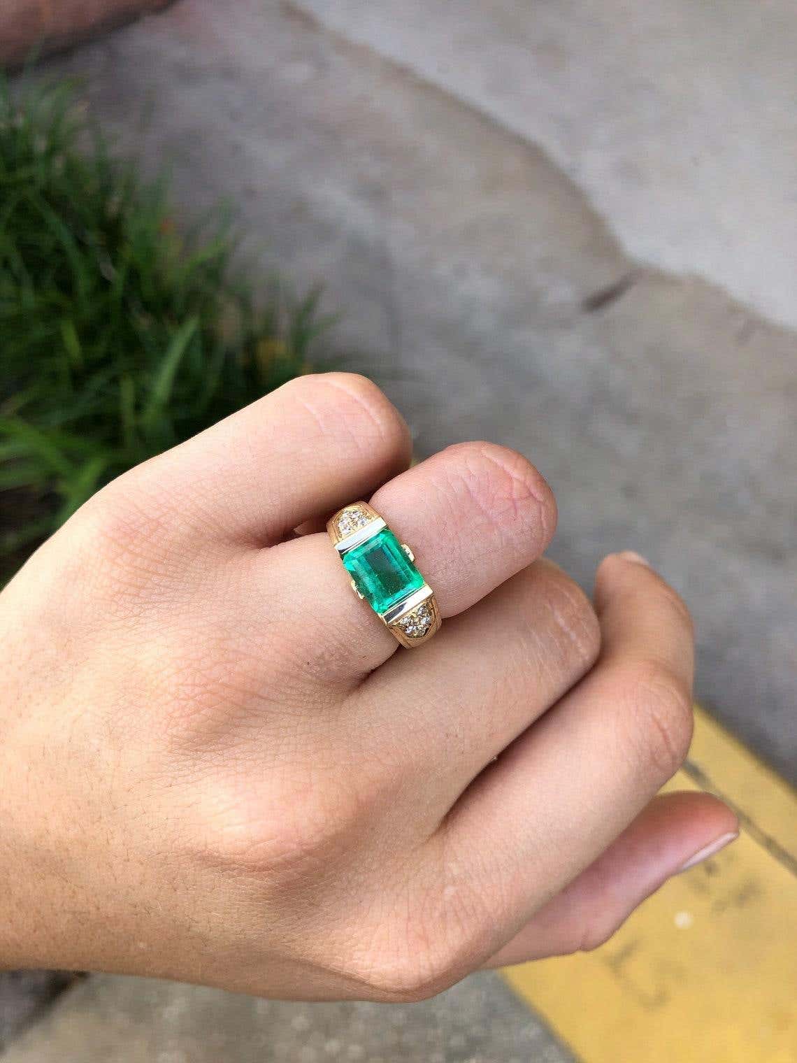 Natural 2.60ct Colombian emerald engagement ring with east-west three-stone emerald cut design in 14K gold by JR Colombian Emeralds.