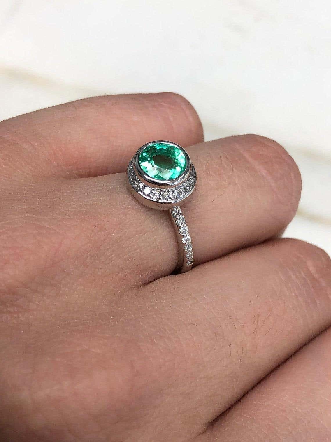 14K Colombian emerald and diamond halo engagement ring with 1.60 carat round emerald, by JR Colombian Emeralds.