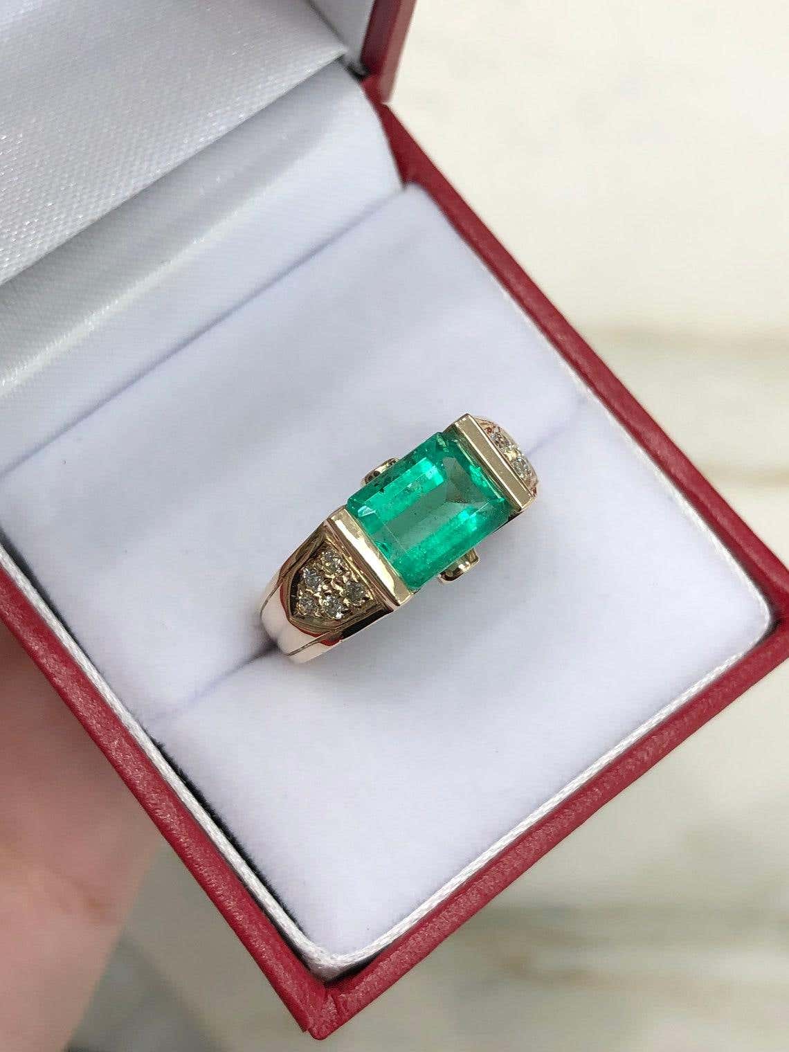 Natural Colombian emerald engagement ring with 2.60ct emerald cut stones in 14K gold, featuring three-stone east-west design by JR Colombian Emeralds
