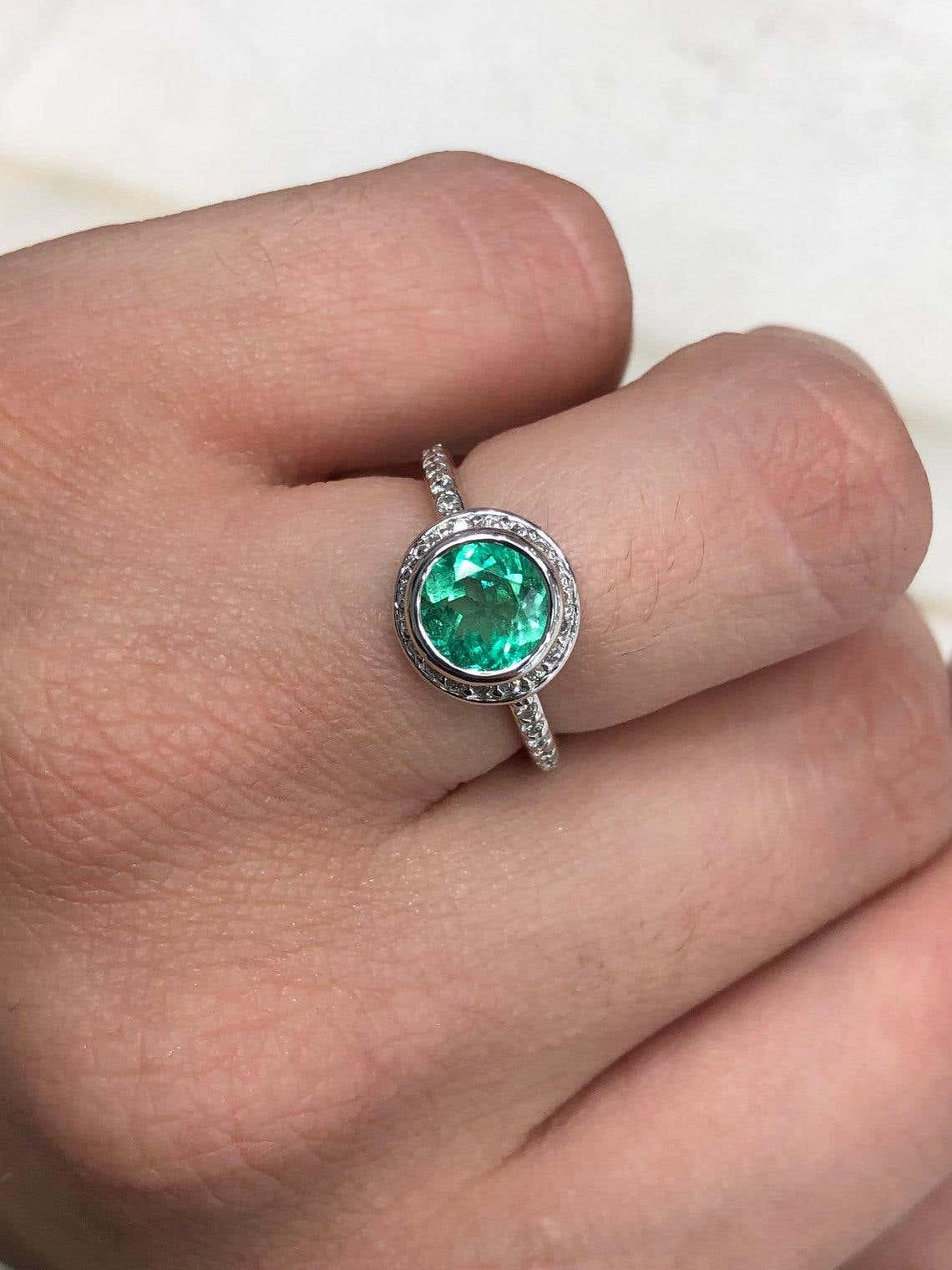 Round Colombian emerald engagement ring with diamond halo, 1.60 carats, set in 14K gold by JR Colombian Emeralds.