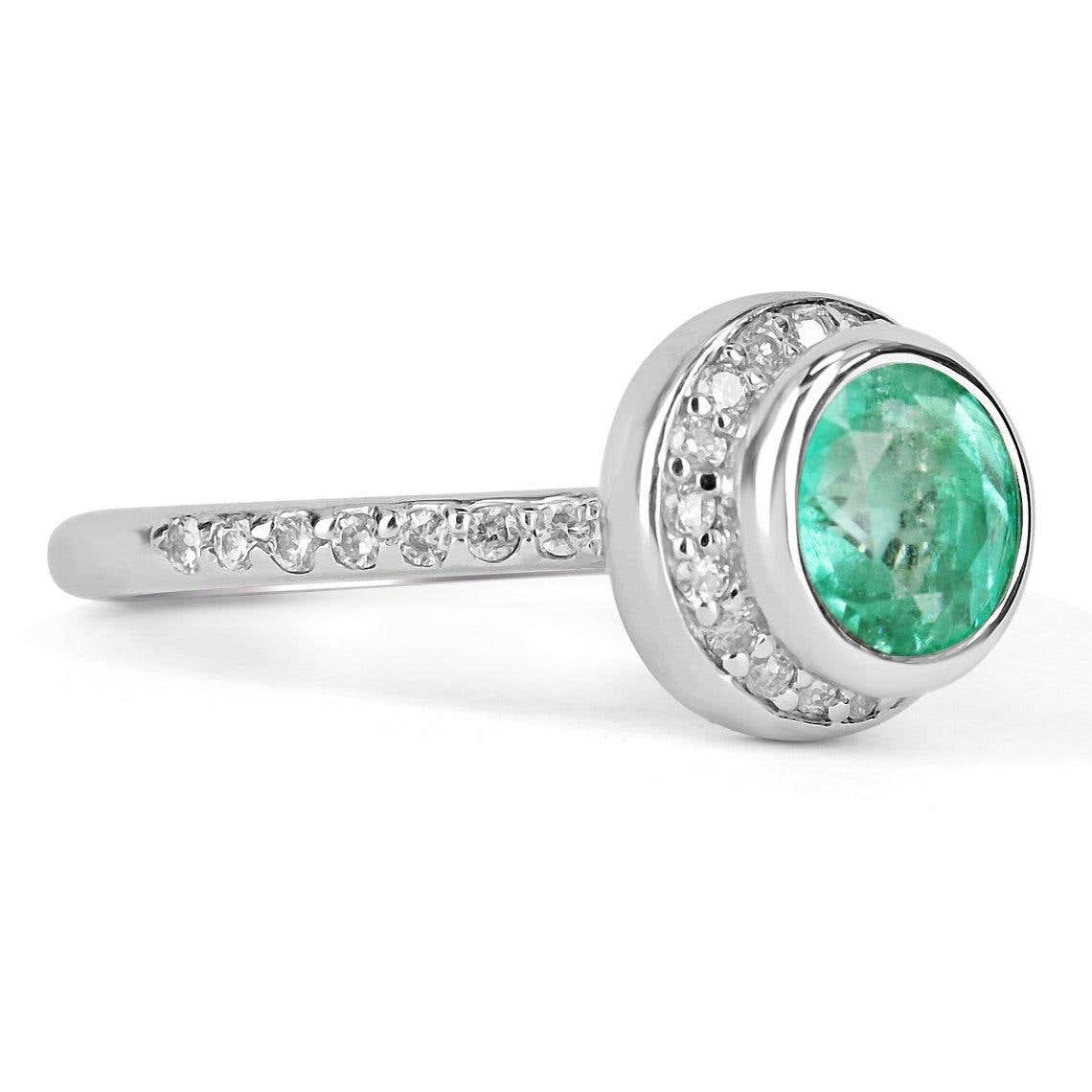 Round Colombian emerald diamond halo engagement ring in 14K gold with 1.60 carats from JR Colombian Emeralds.