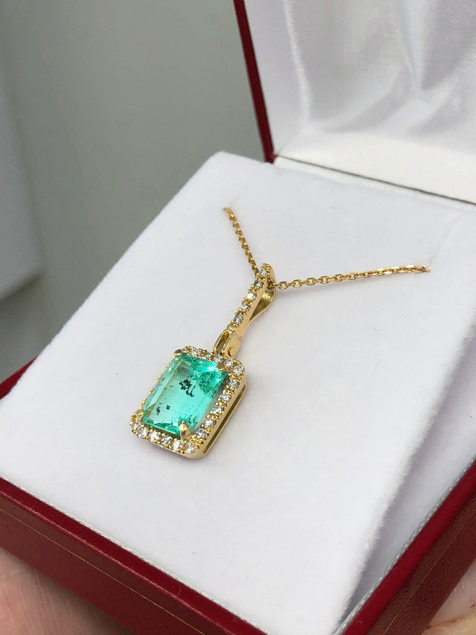 Elegant 4.18 TCW Emerald and Diamond Halo Pendant in 14k Gold