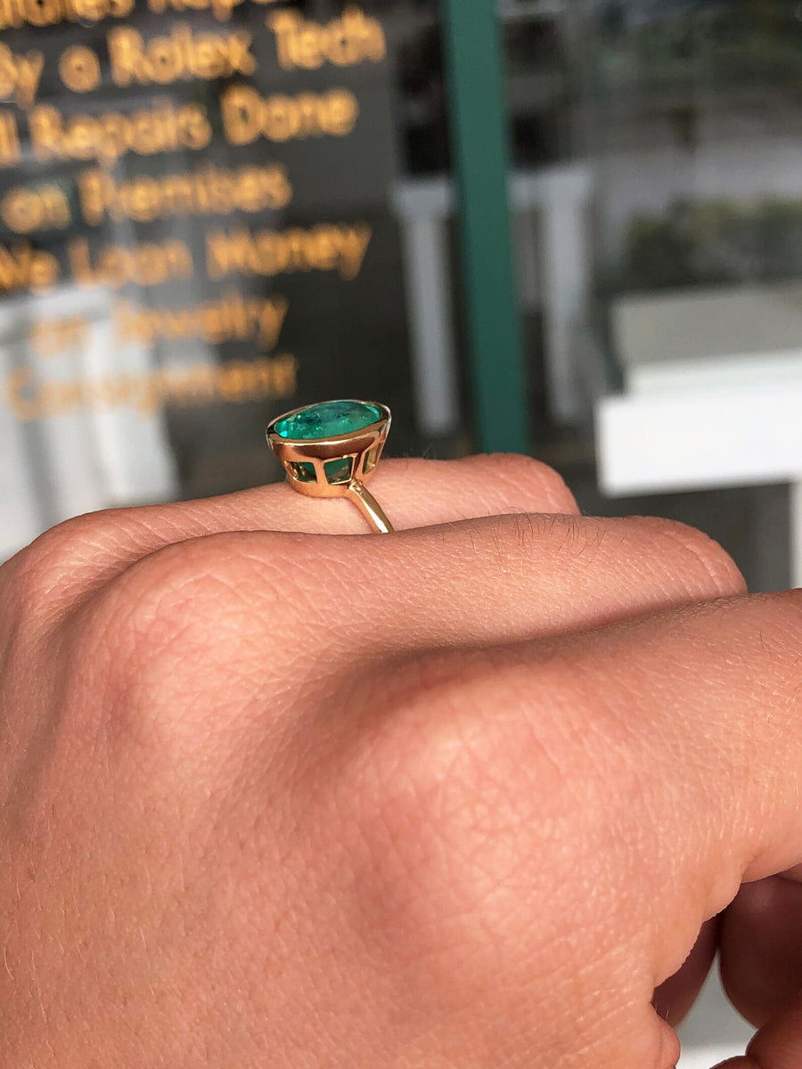 Eternal Radiance: 14K Gold Ring with 3.0 Carat Bezel Set Oval Emerald Solitaire - A Timeless Beauty