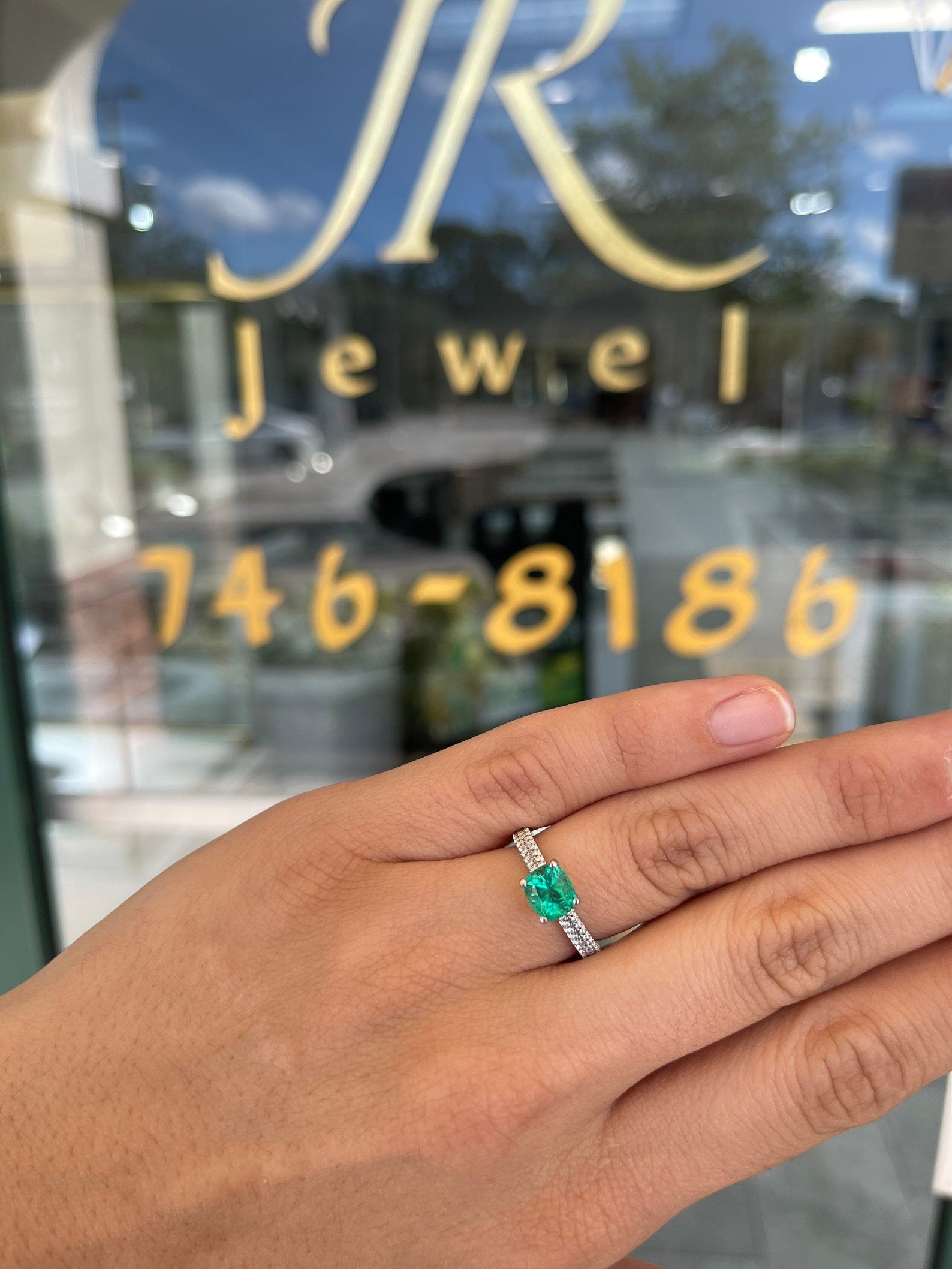 14K gold engagement ring with a 1.75 carat cushion cut Colombian emerald set in a prong mounting, from JR Colombian Emeralds.