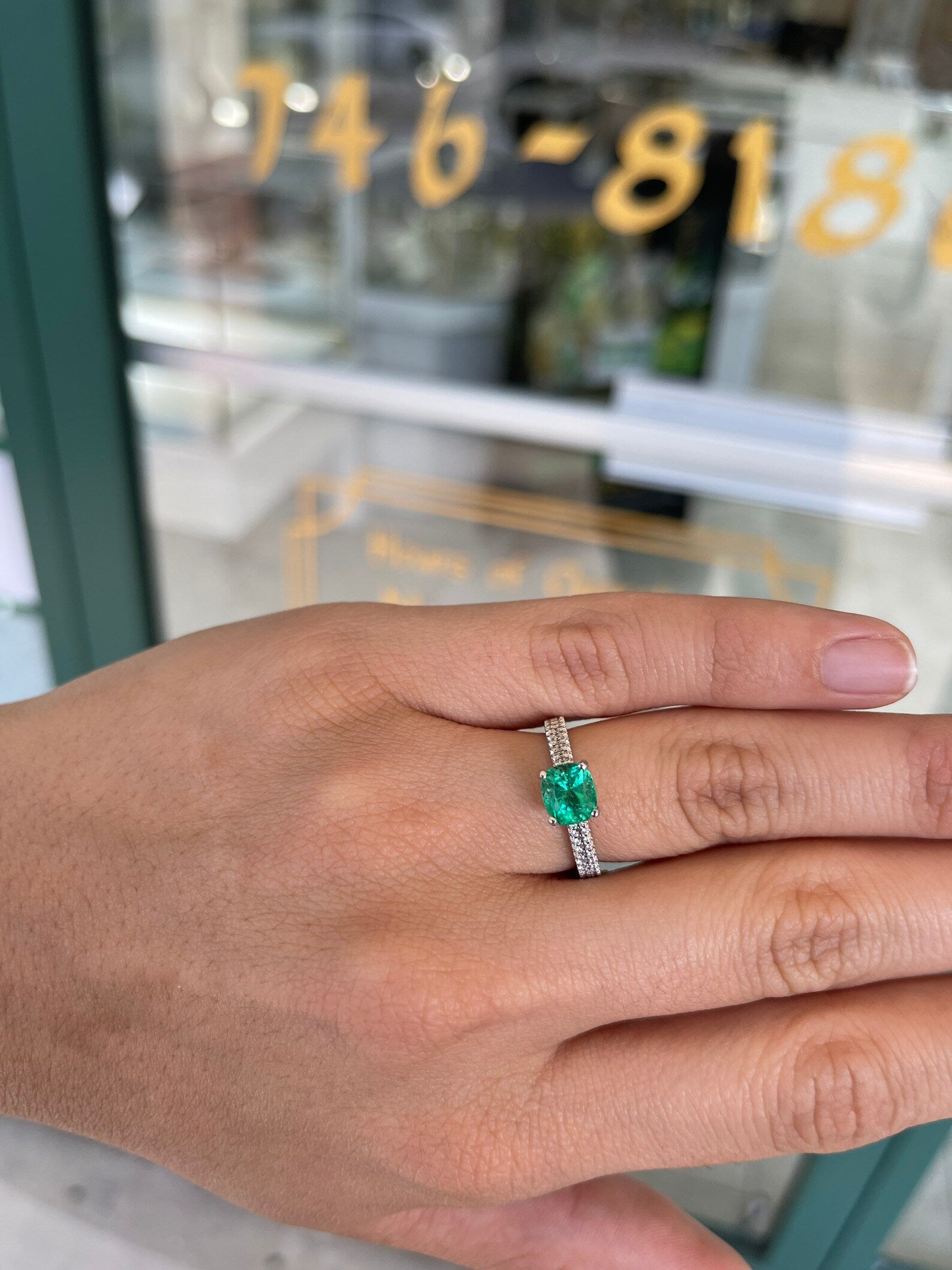 14K gold Colombian emerald engagement ring with a 1.75 carat cushion cut emerald and diamond prongs by JR Colombian Emeralds