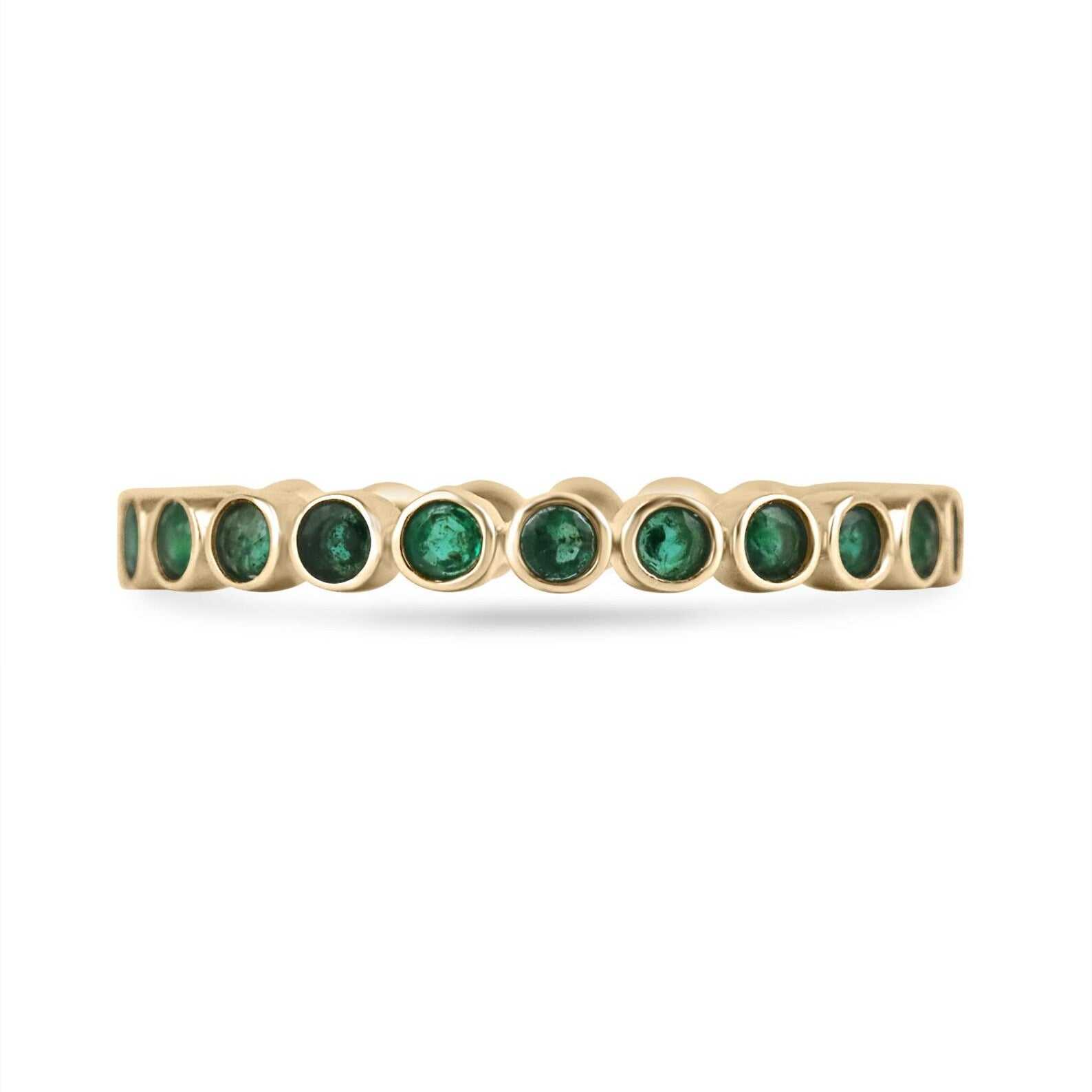 14K gold emerald eternity band with round cut stones, bezel set, size 7.