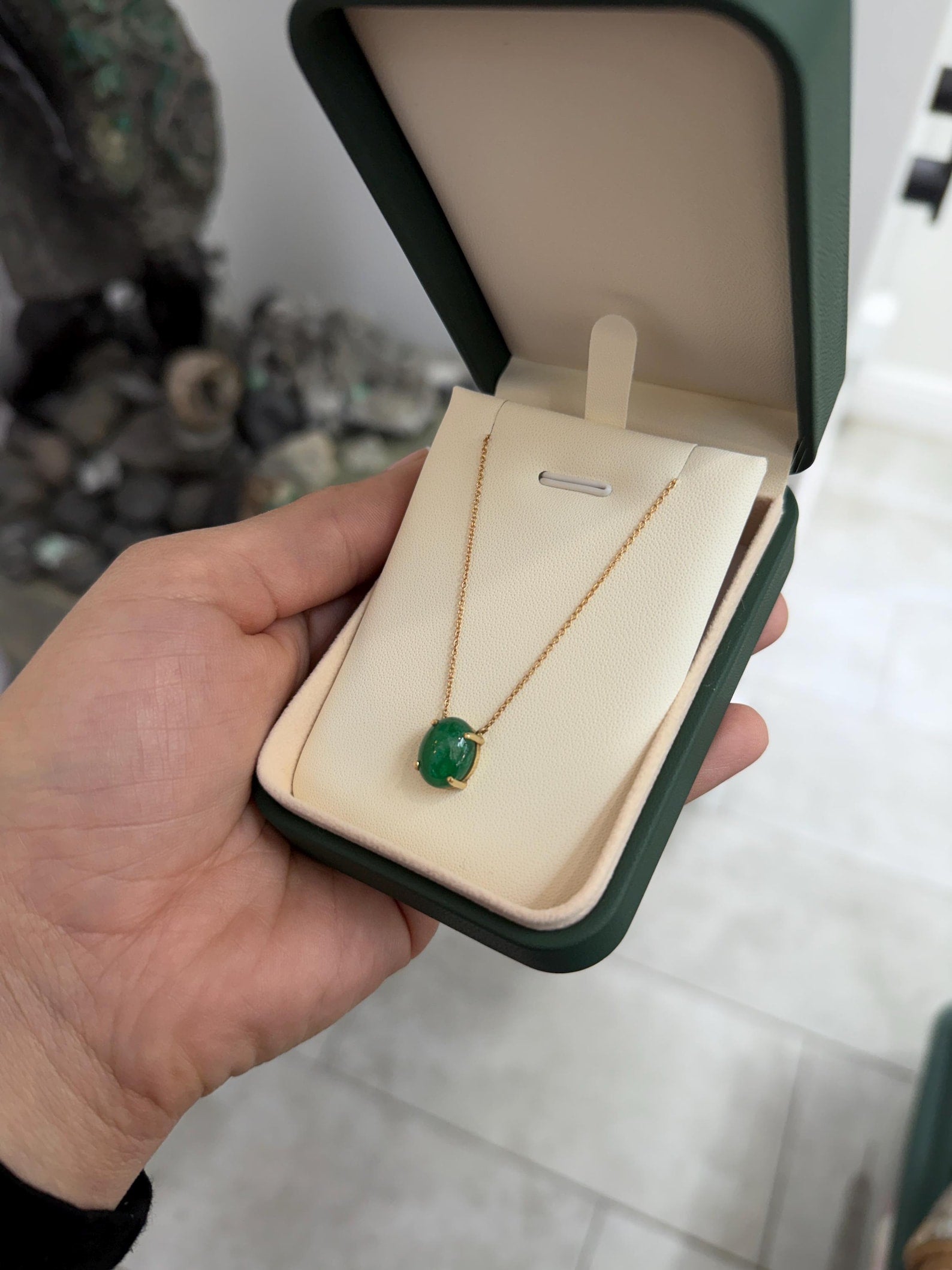 14K gold necklace with 5.50tcw Zambian emerald cabochon pendant from JR Colombian Emeralds, showcasing a prong station design.