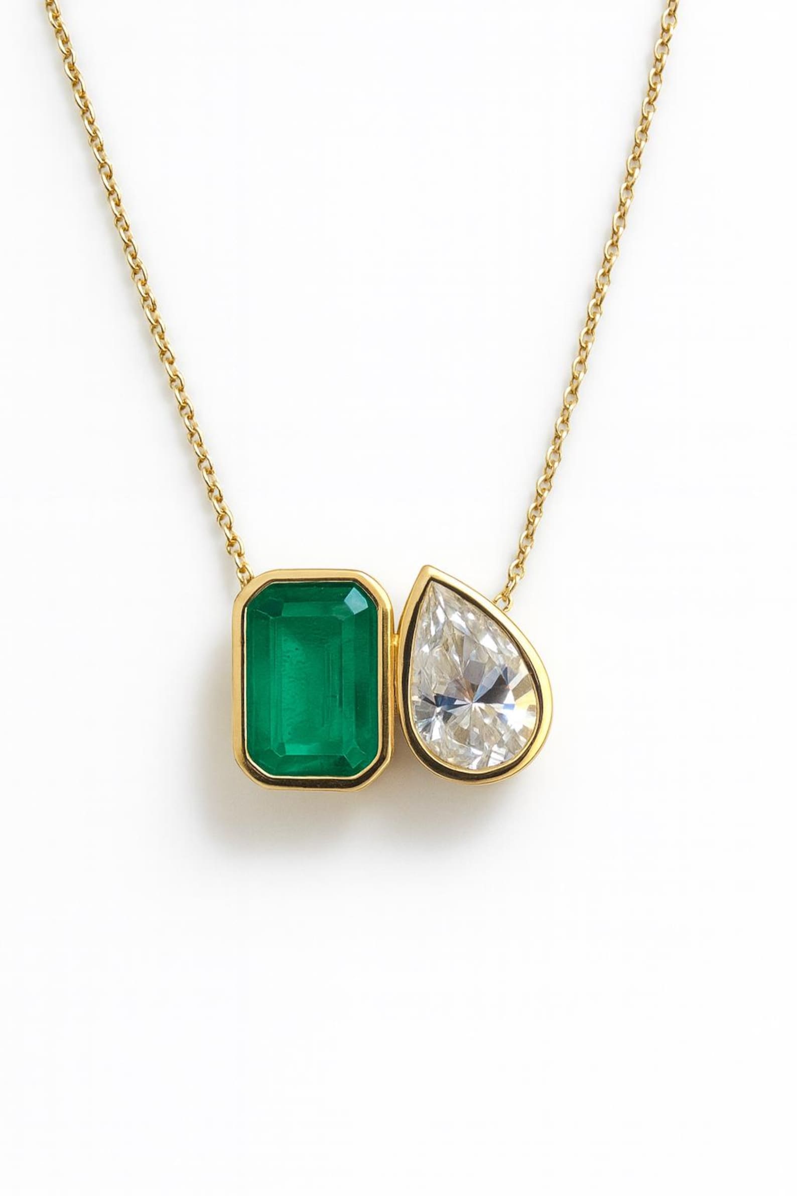 Emerald moissanite Toi Et Moi pendant necklace with two gemstones, featuring a silver chain and elegant design by JR Colombian Emeralds