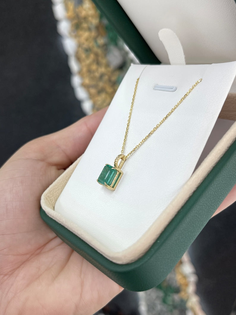 Sophisticated Four Prong Emerald Pendant on a 14K Gold Rope Necklace