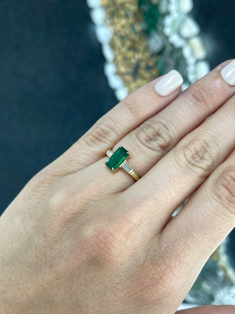 14K gold 2.45tcw dark green emerald and diamond accented 3-stone engagement ring by Colombian Emerald, featuring tapered baguette diamonds.