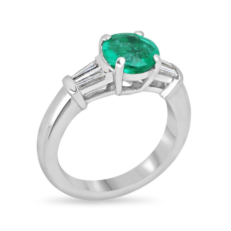 Platinum Engagement Ring with 2.18 Total Carat Weight of Round Cut Emerald and Tapered Baguette Diamond Accents in Stunning Green Hue