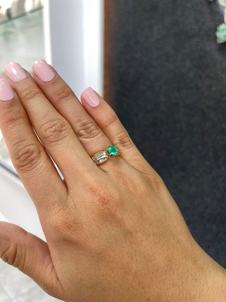 Celebrate Brilliance: 14K Gold Ring Featuring 0.85tcw Two-Toned Round Cut Emerald & Tapered Baguette Diamonds