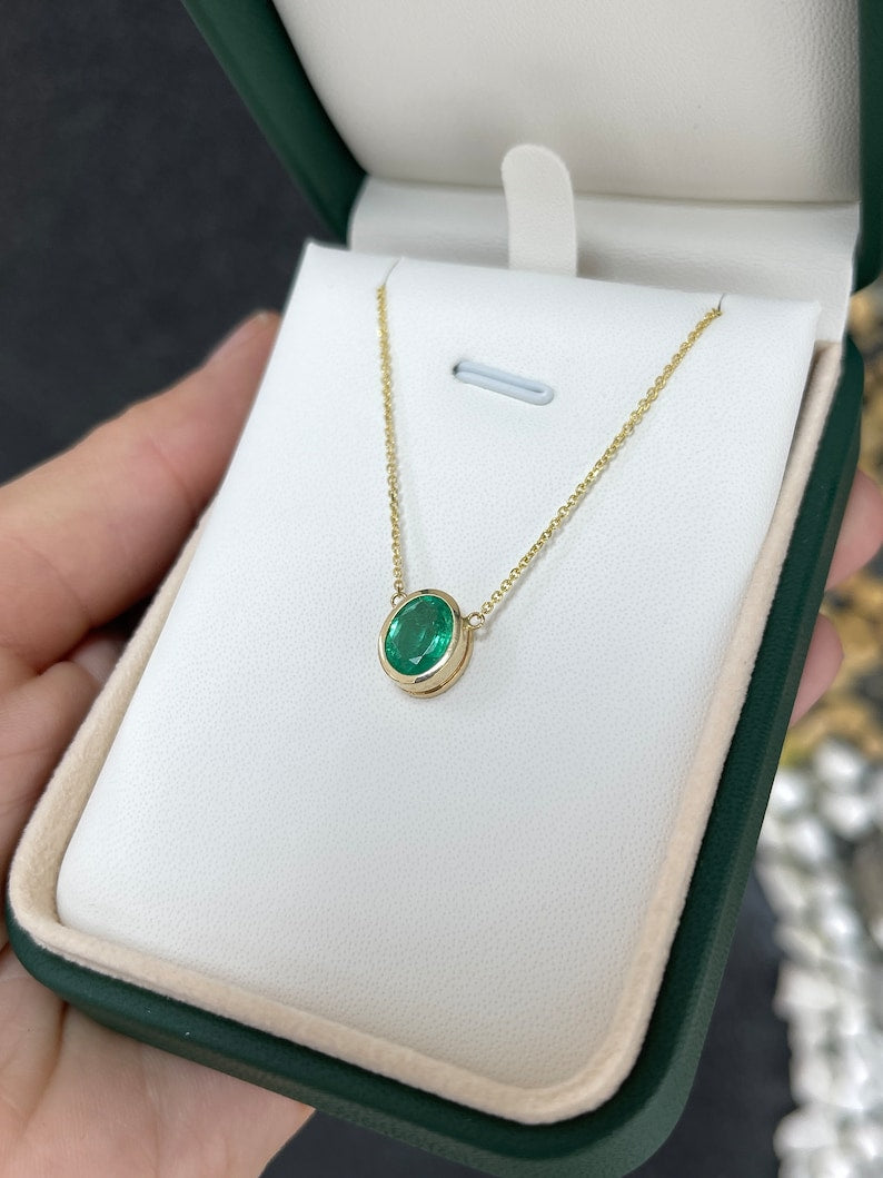 Vertically Set Oval Cut Vivid Medium Green Emerald in Gold Necklace