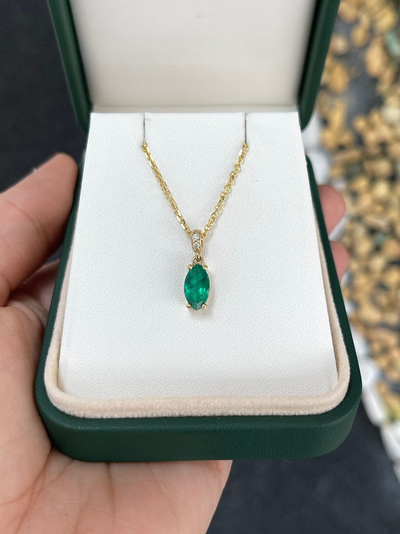 1.04tcw 18K Gold Marquise Solitaire Cut Emerald & Diamond Accent Necklace