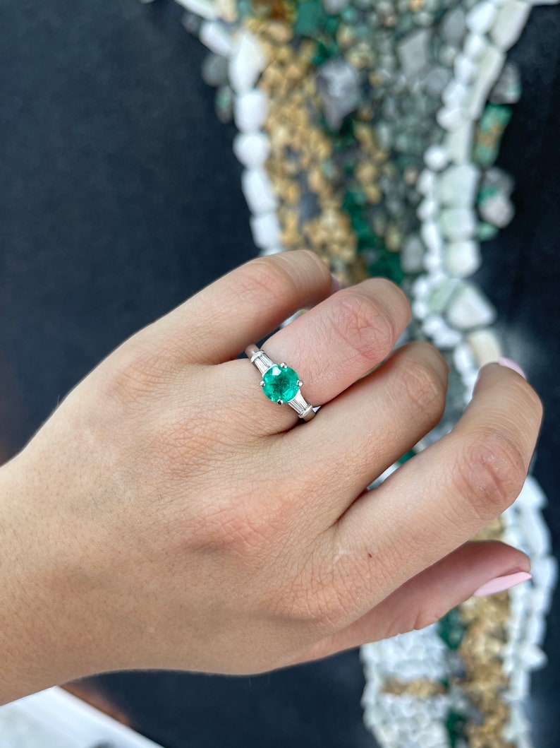 2.18 Carat Emerald and Platinum Engagement Ring with Round and Baguette Diamonds in a Striking Green Hue