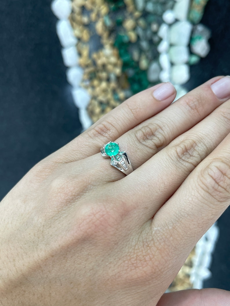 Beautiful 6-Prong Women's Ring with 1.25 Carats of Round Emerald and Tapered Baguette Diamond Accents in 18K White Gold
