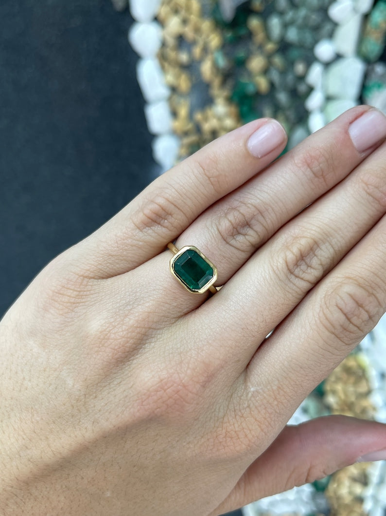 Luxurious Natural Emerald Solitaire Ring in 14K Gold with a 4.28 Carat Dark Green Stone