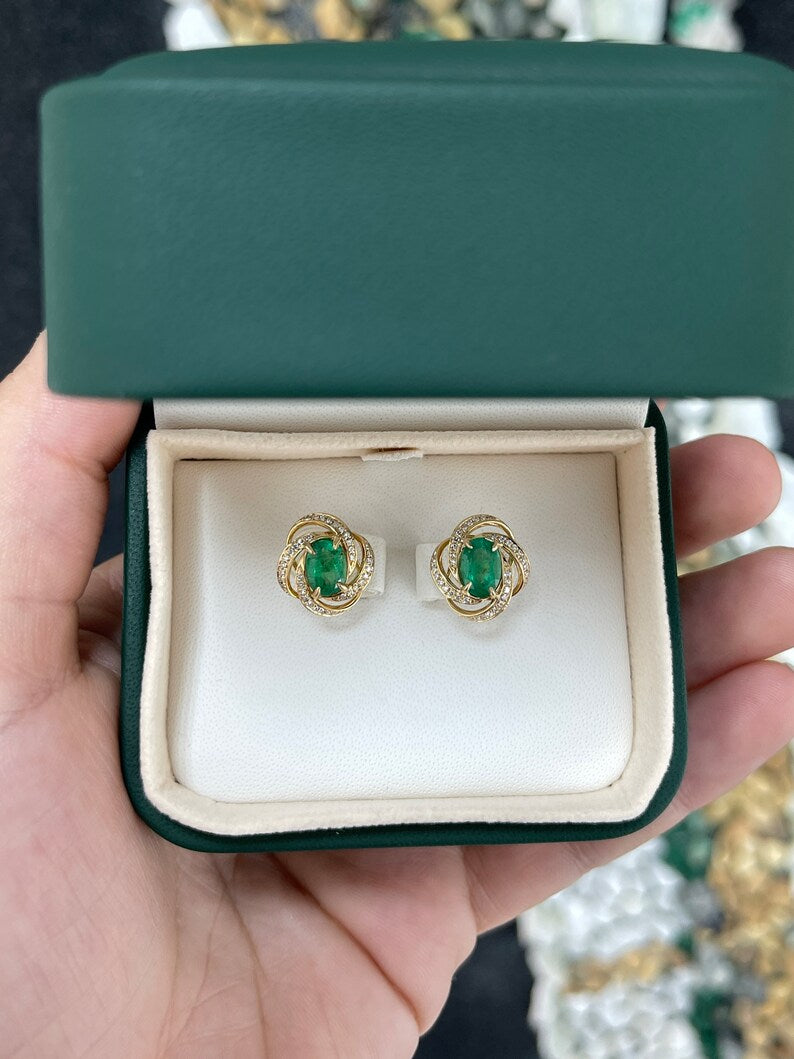 Medium Dark Green Oval Emerald & Diamond Earrings: 2.31 Total Carat Weight in 14K Gold Whirl Halo Style