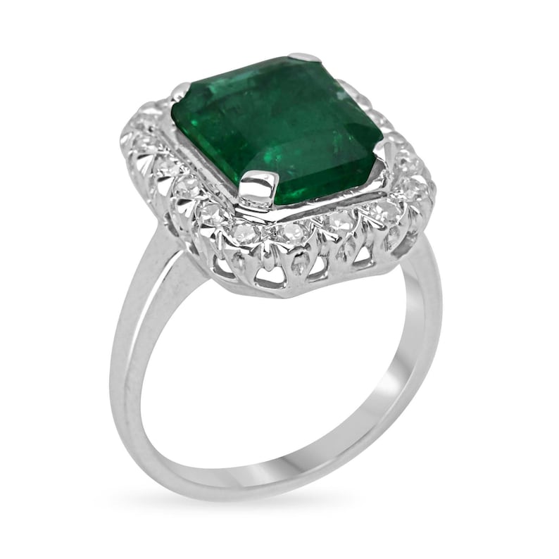 White Gold 585 Prong Set Engagement Ring Featuring 4.49tcw Dark Green Emerald and Round Cut Diamond Halo