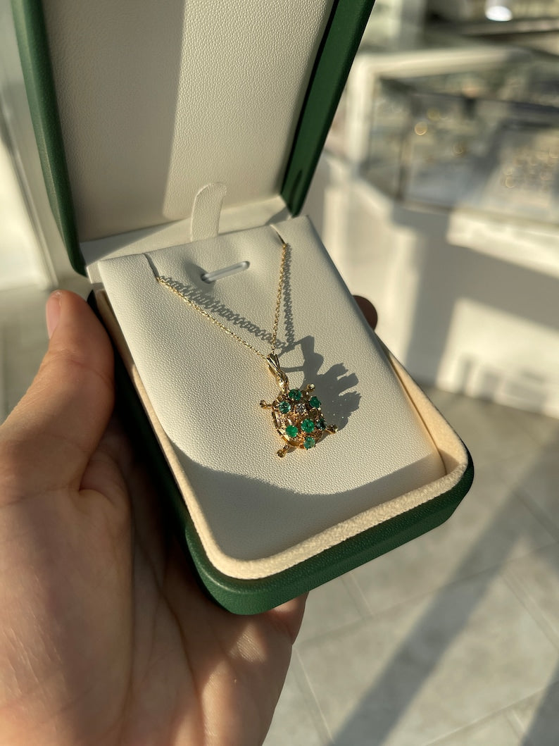 0.64 Carat Round Cut Emerald and Diamond Accent Sea Turtle Pendant Necklace in 14K Gold
