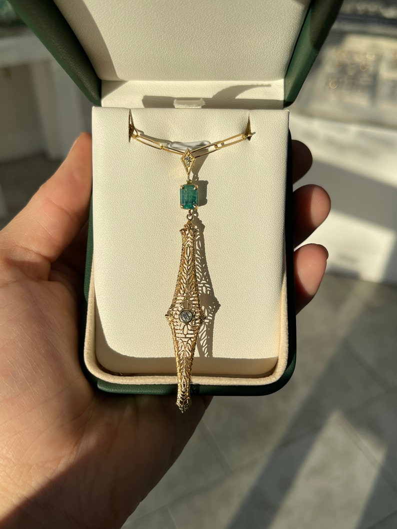 14K Gold Pendant Necklace with 1.48 Total Carat Weight Natural Green Emerald and Diamond Accent from the 1910s