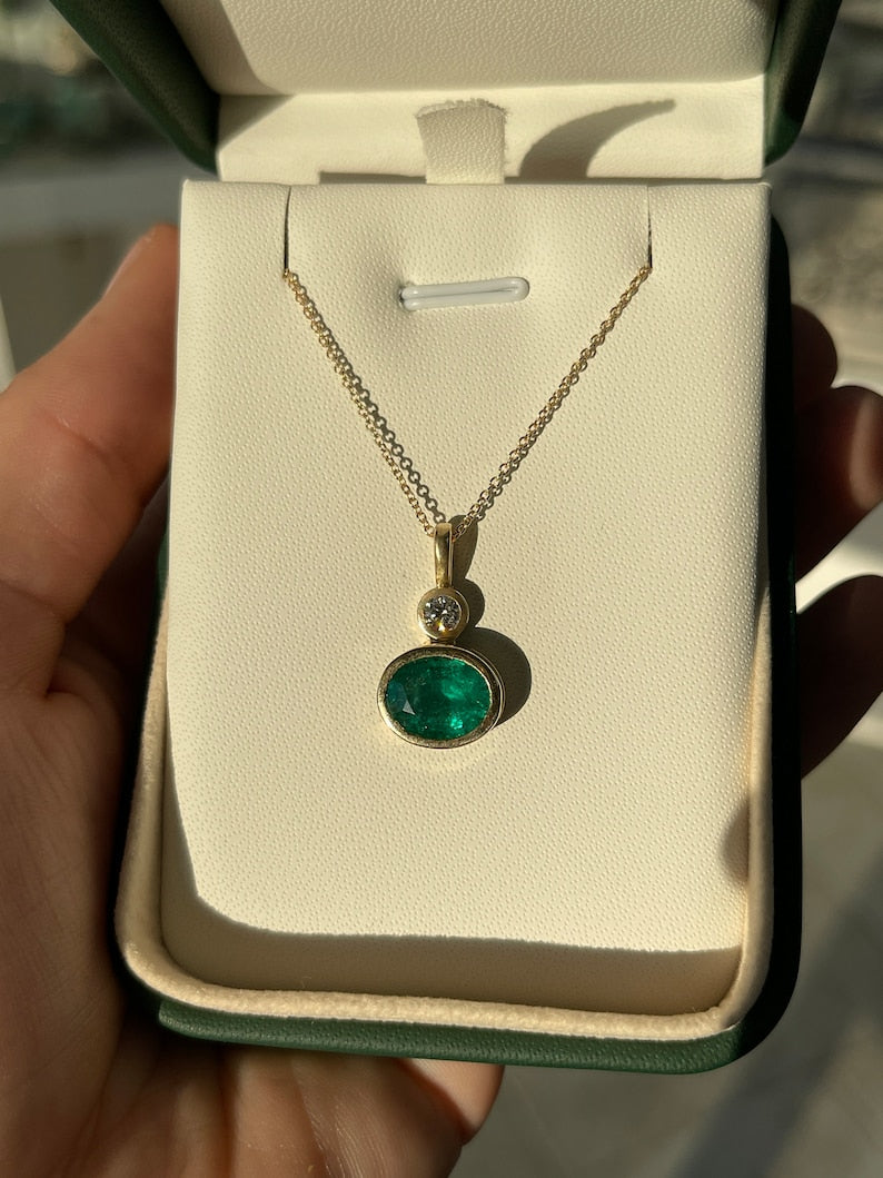 Oval Emerald Pendant in 14K Gold with Brilliant Diamond Highlights (3.70tcw)